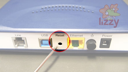 The 'Reset' button on an NB6 is in a recessed hole between the 'USB' and 'Ethernet' sockets. 