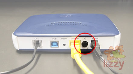 The power button on an NB6 is in-between the Ethernet and Power cables. 